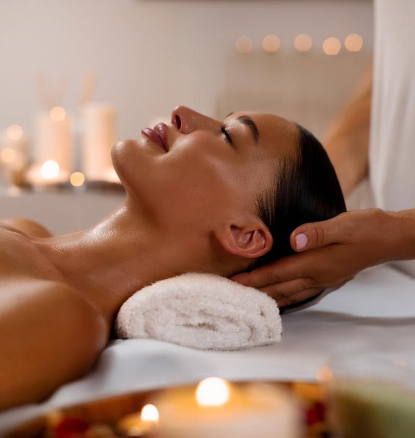 A woman receiving a massage at the spa