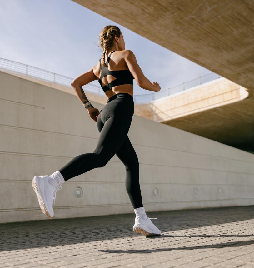 Woman running alone in a city 