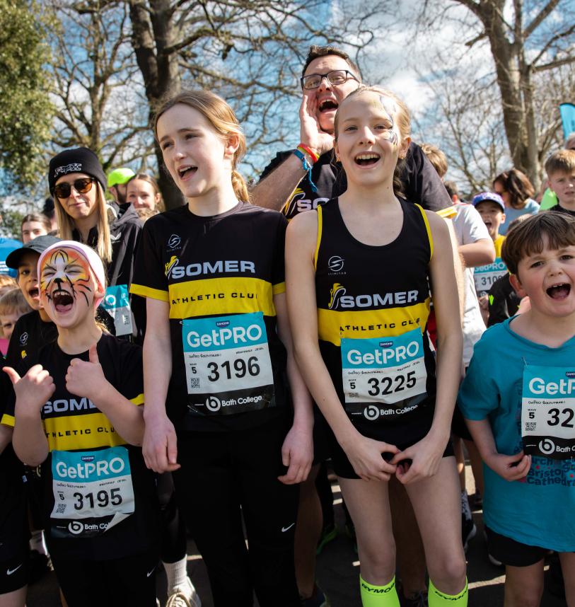 Smiling participants on the Start Line of the Bath Miles