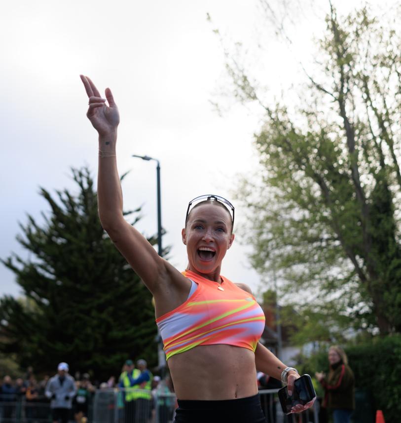 Runner poses for the camera mid-run