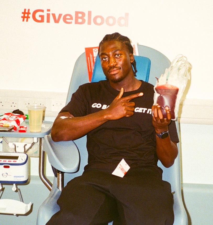 Blood donor with their donation 