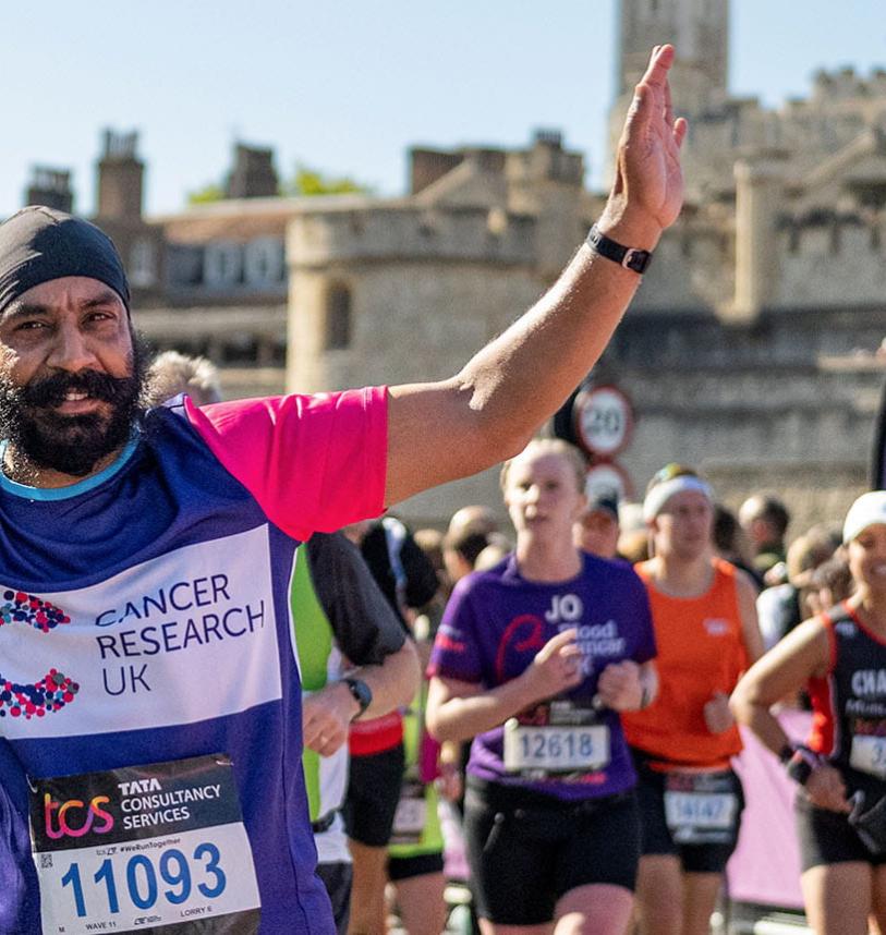 TCSLM 2022 charity runner with Tower of London in the background