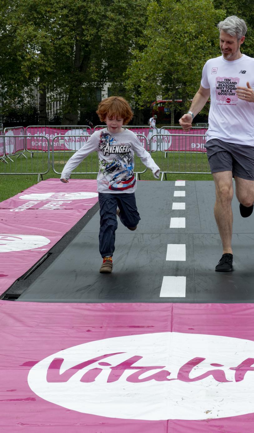 Participants take on the Tumbleator which is a giant 20-foot long treadmill
