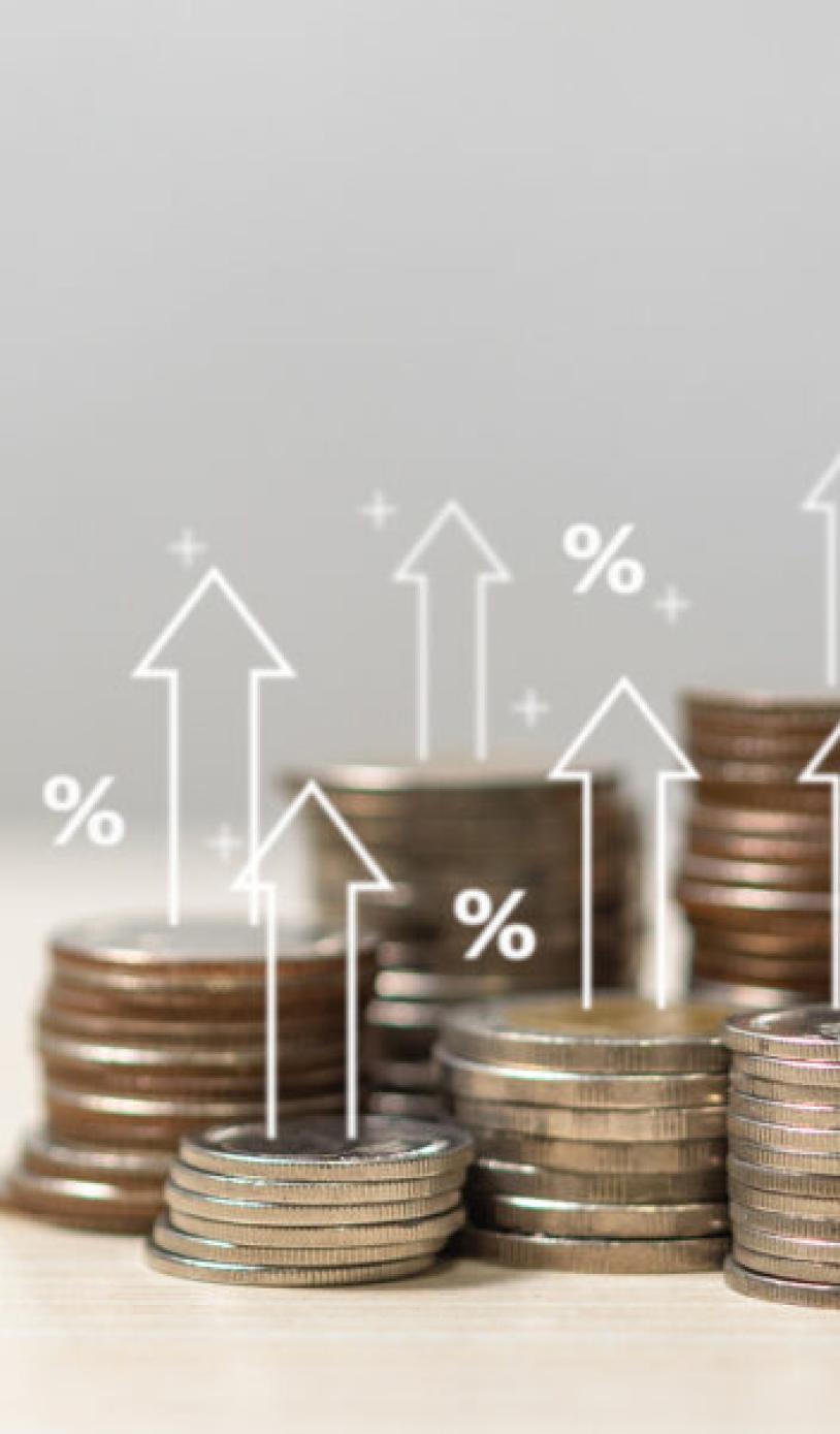 Coins with super-imposed arrows indicating financial growth within fundraising.