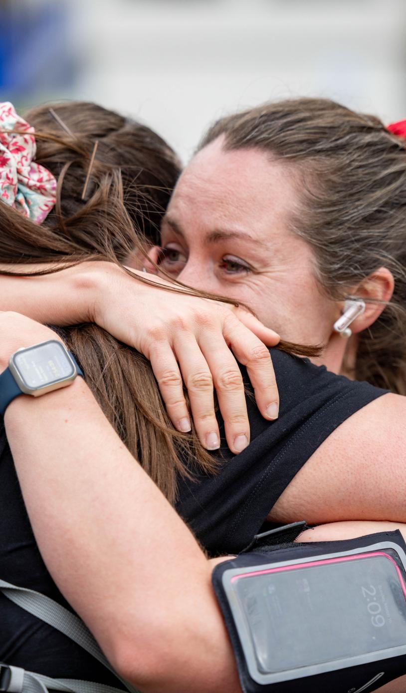 Participants hug each other