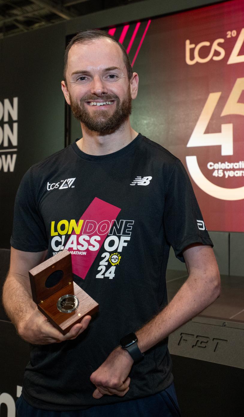 Ant Bryan with his Spirit of London Marathon award
