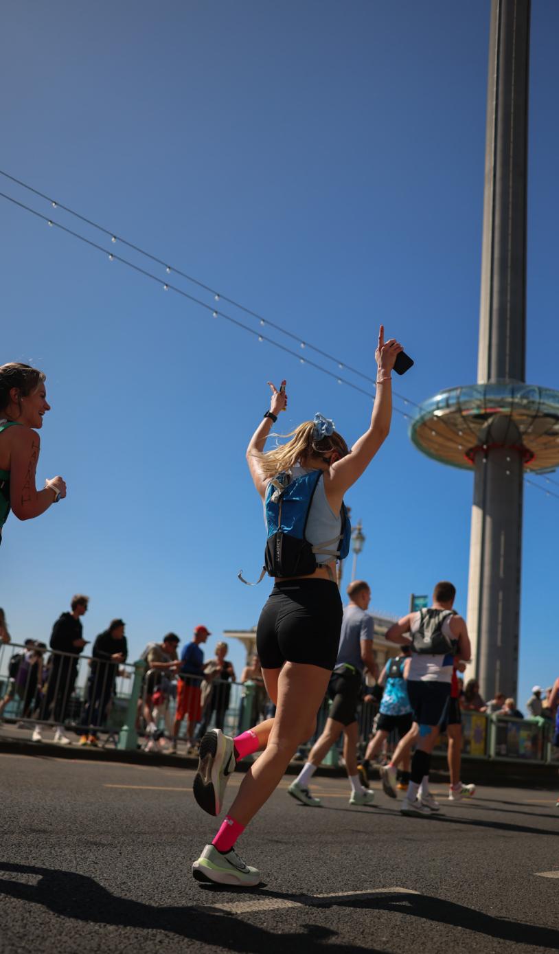Runners cheering on the course