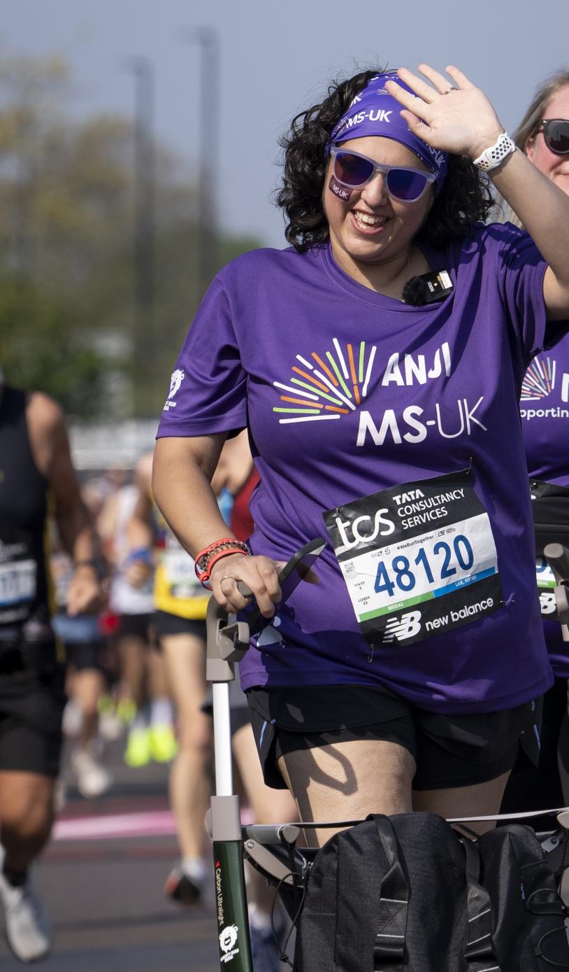 A participant using a frame walker leaves the Start Area 