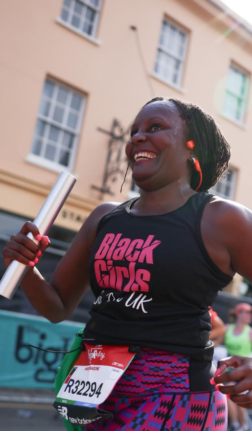 Relay participant carrying a baton 