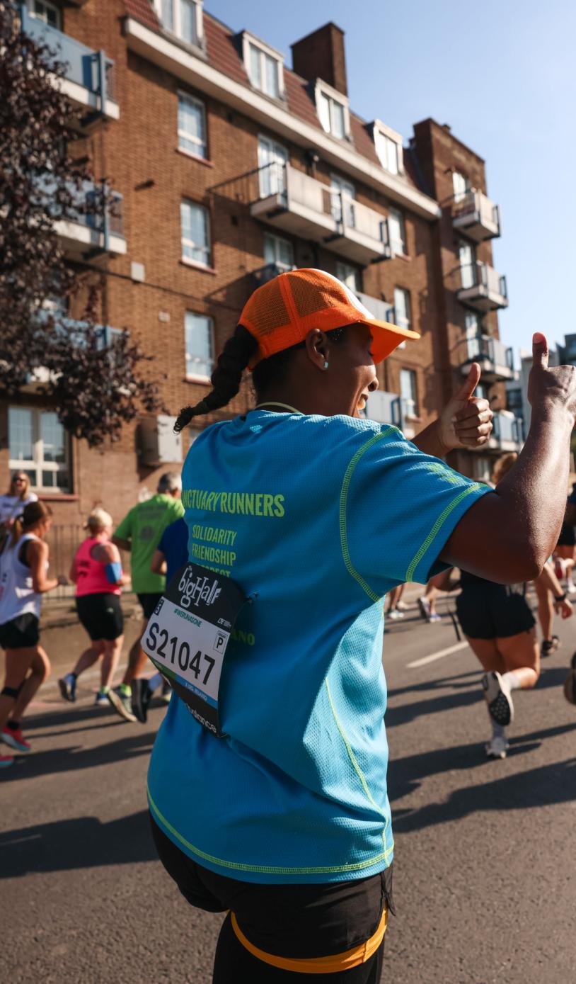 Sanctuary Runners participants gives a thumb up 