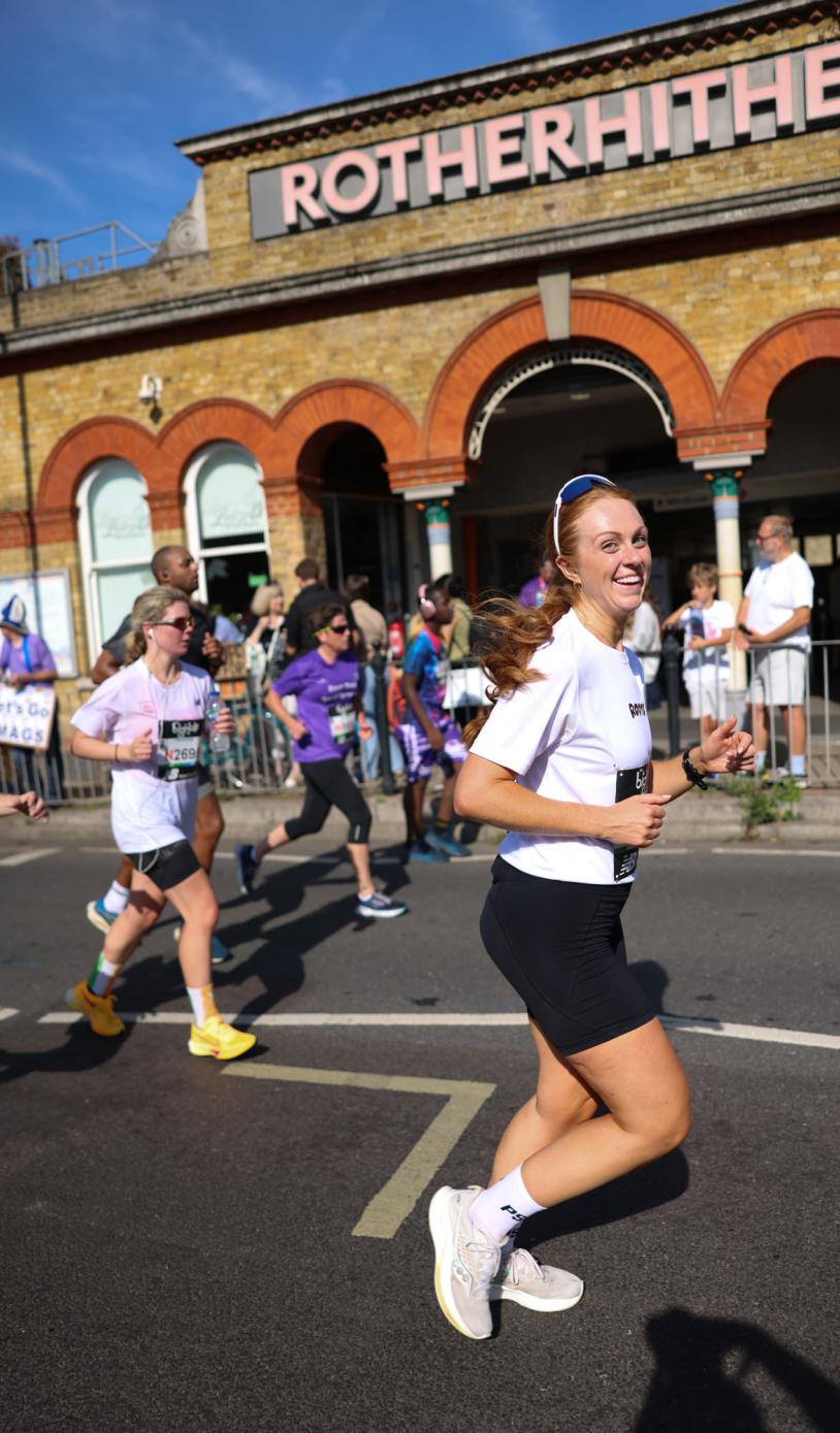 Runners passing Rotherhithe station