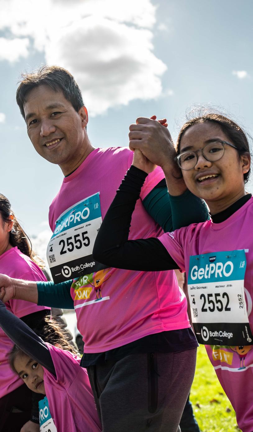 A family celebrates finishing the Bath Miles