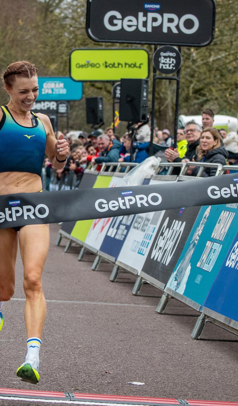 Alex Bell celebrates winning the 2026 GetPRO Bath Half