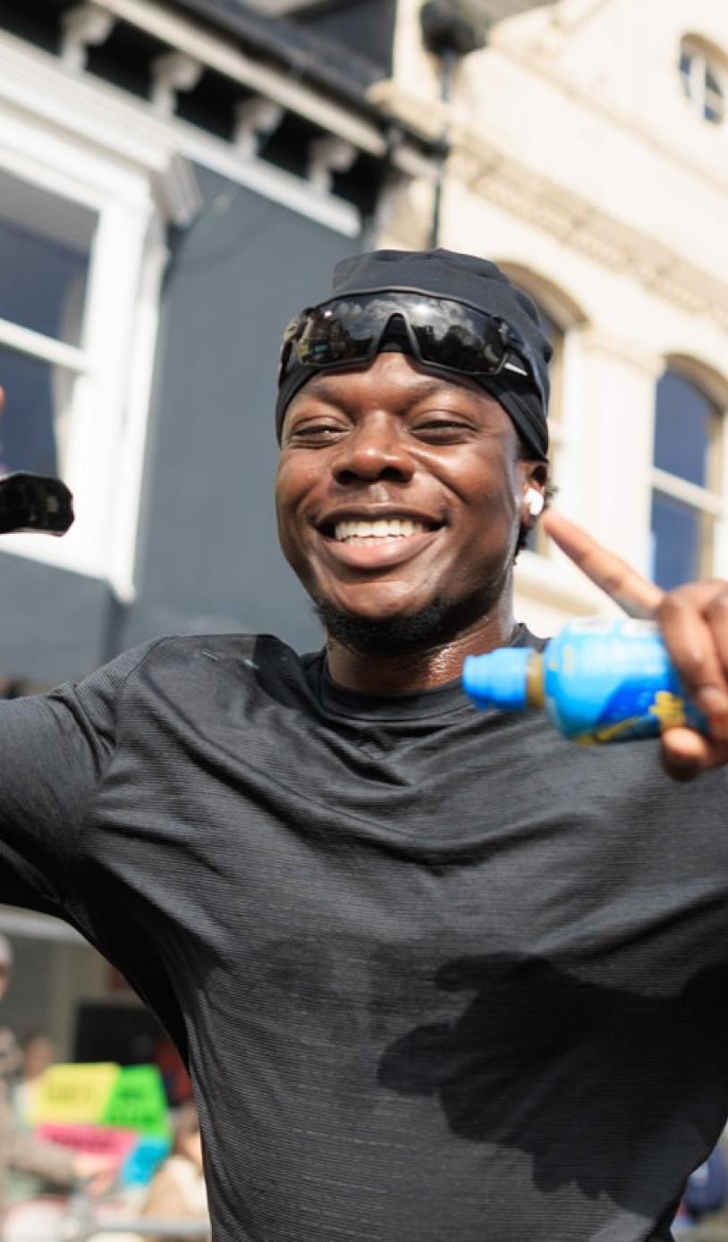 Runner poses for the camera mid-run