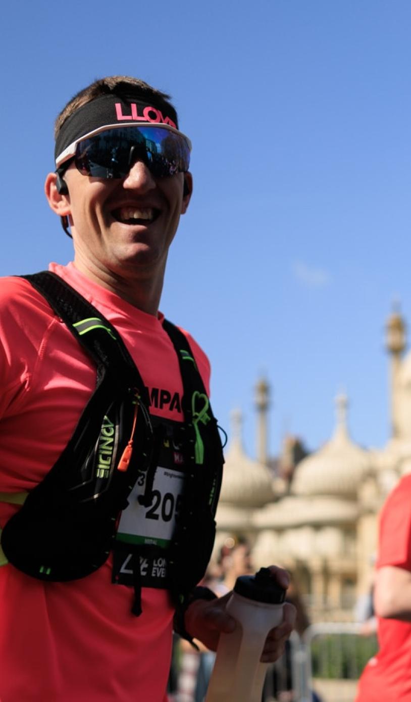 Runners give the camera a thumbs up 