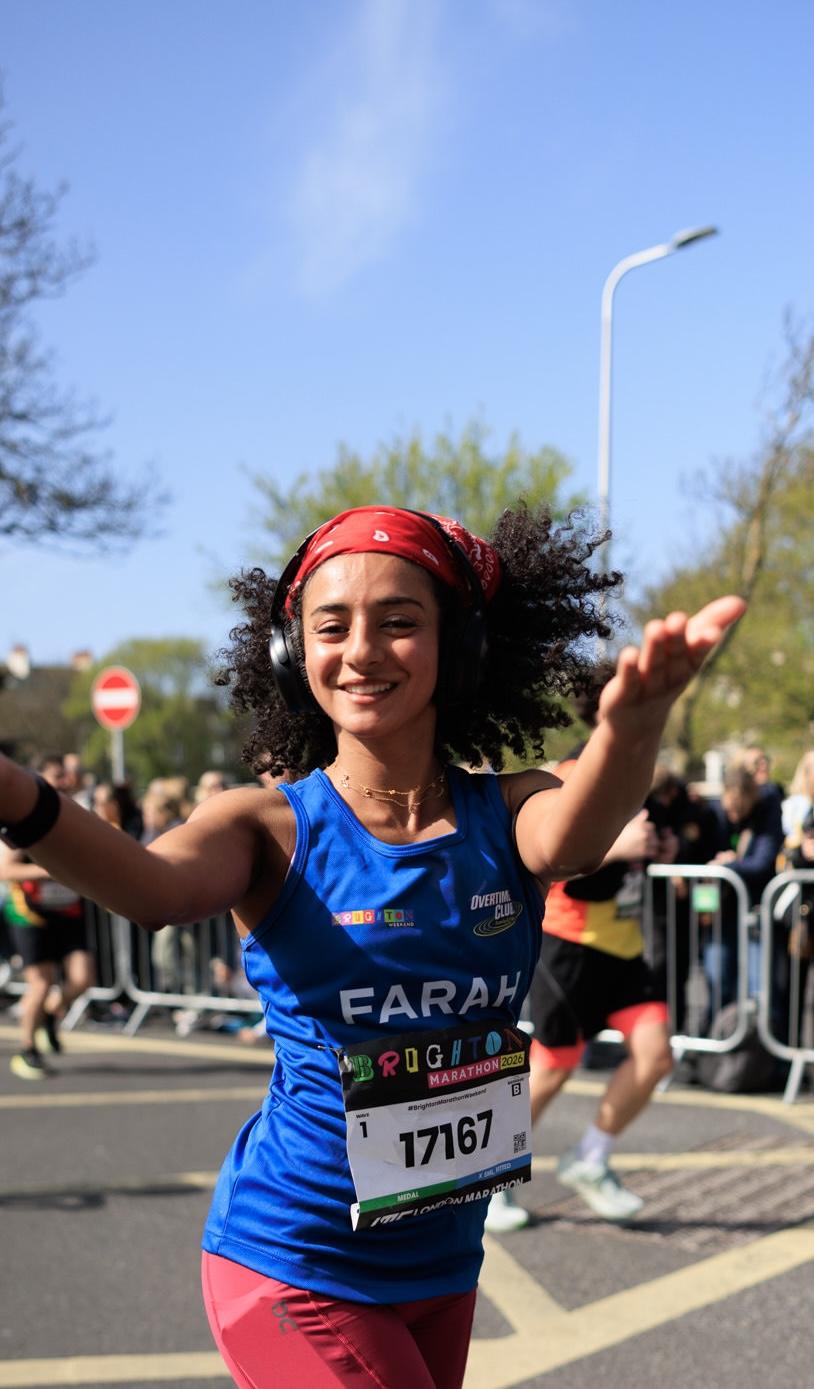 Runner poses for the camera mid-run