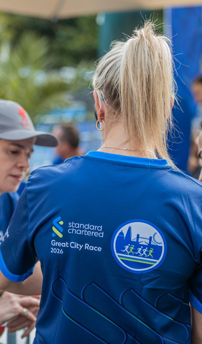 Runners huddle at the City Race Start Line