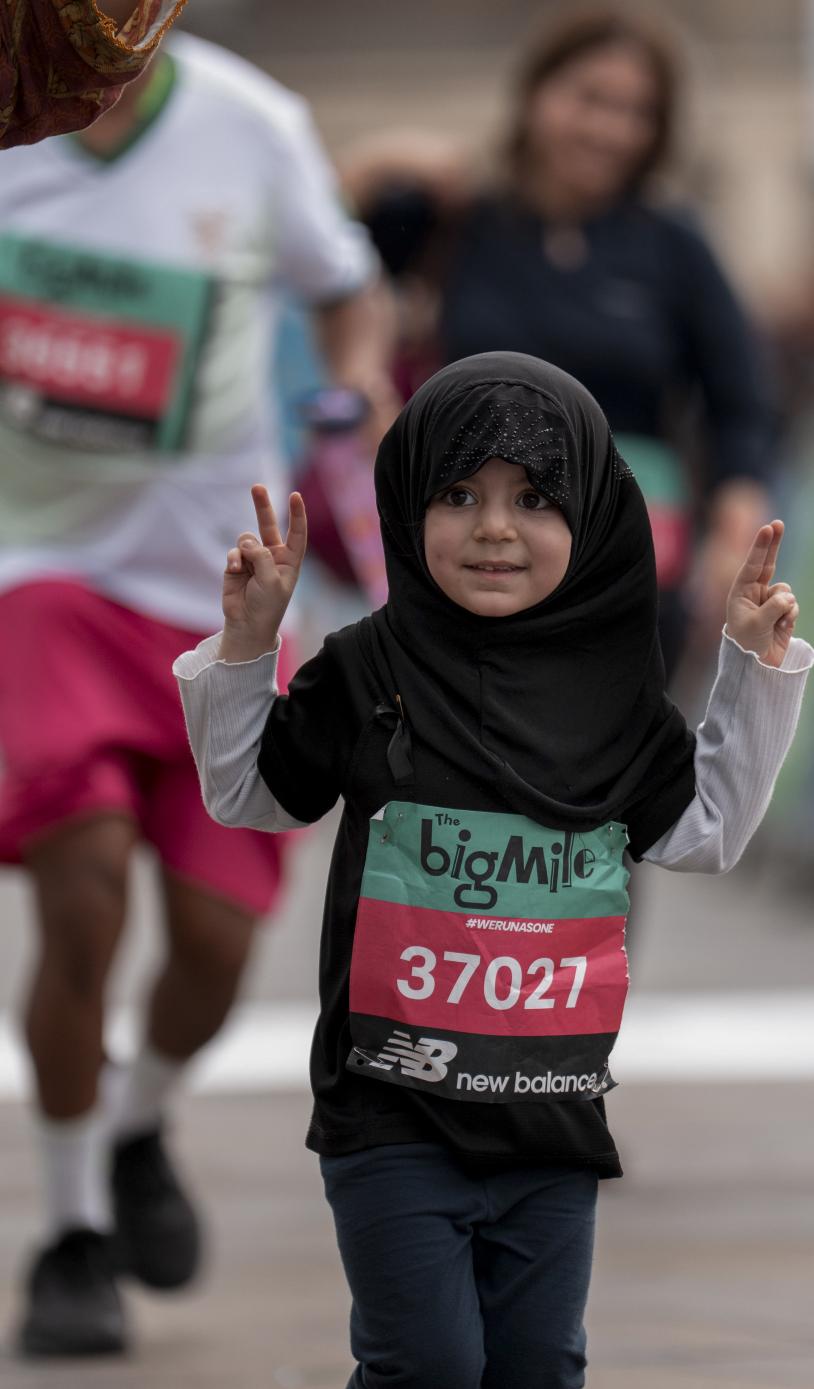 Big Relay young participant gives a peace sign 