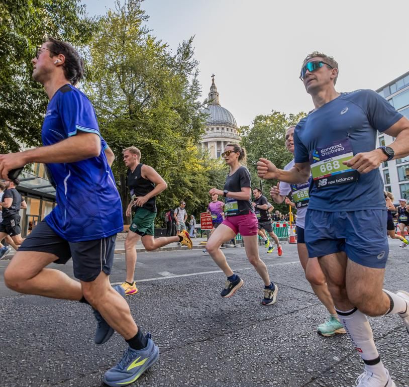 Runners pass St Pauls on the City Race course 