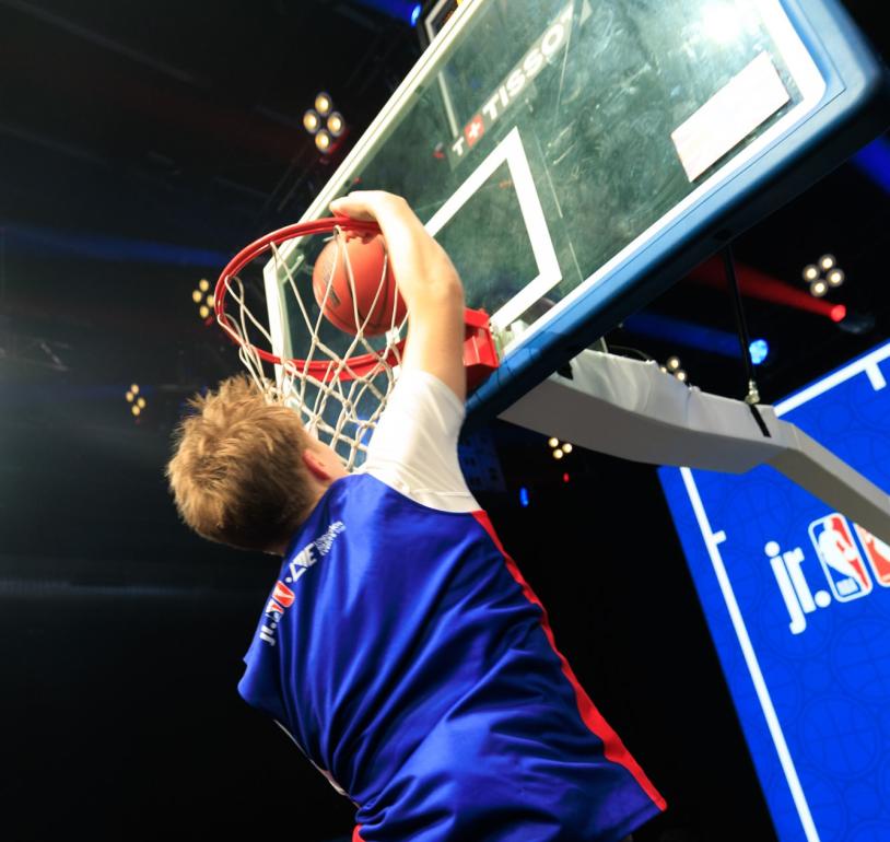 player goes for a slam dunk at Jr. NBA 3v3