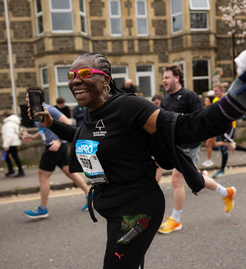 Runner looking overjoyed on the course