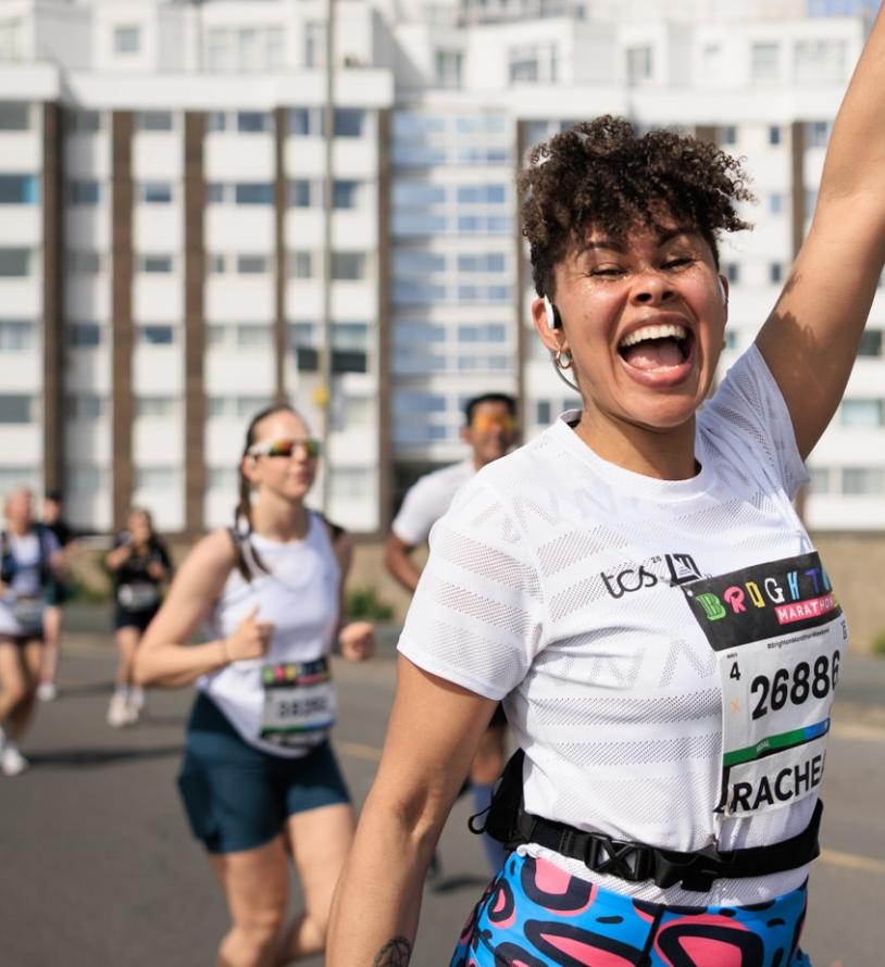 Runner poses for the camera mid-run