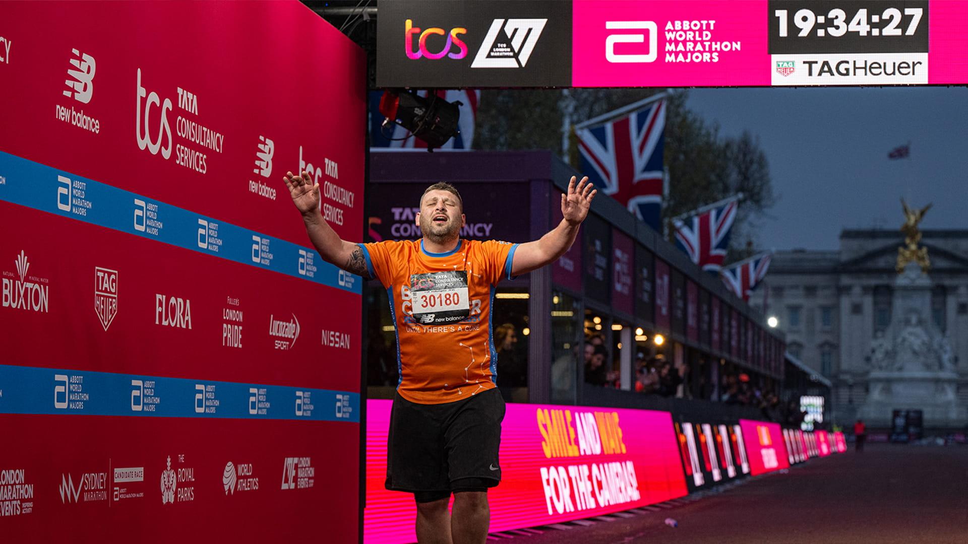Tom During crossing the Finish Line