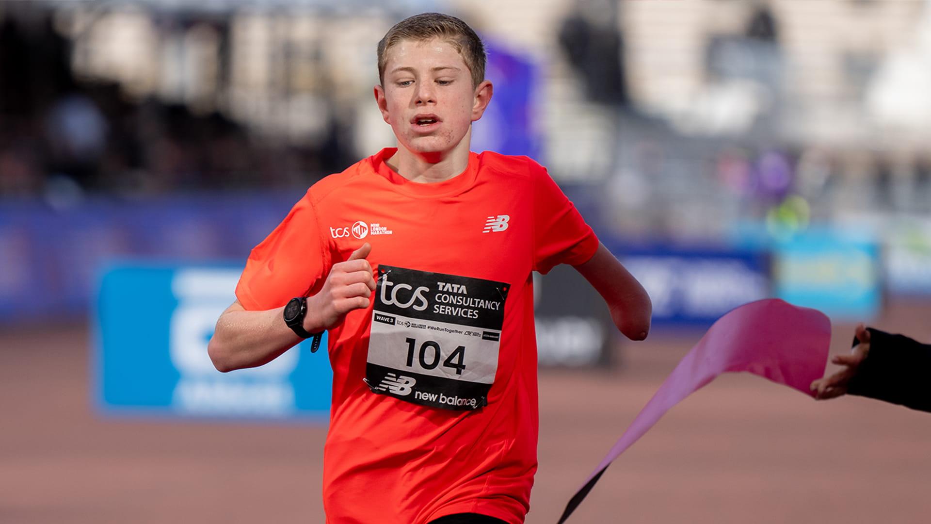 Ollie Scott crossing the Finish Line